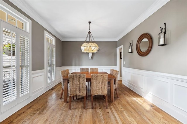 1235 Grand View Dr SE, Smyrna, GA 30126 - dining room with light wood-style flooring, crown molding, wainscoting, and a decorative wall