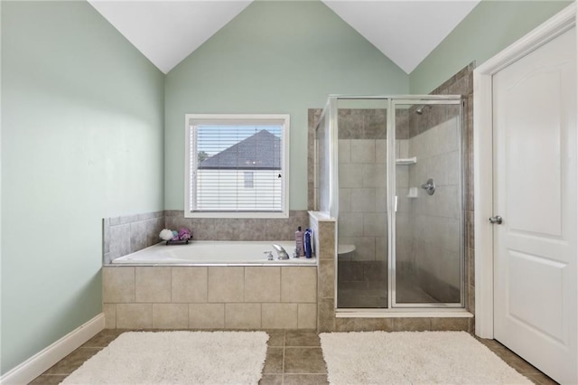 bathroom featuring lofted ceiling, tile patterned floors, and separate shower and tub