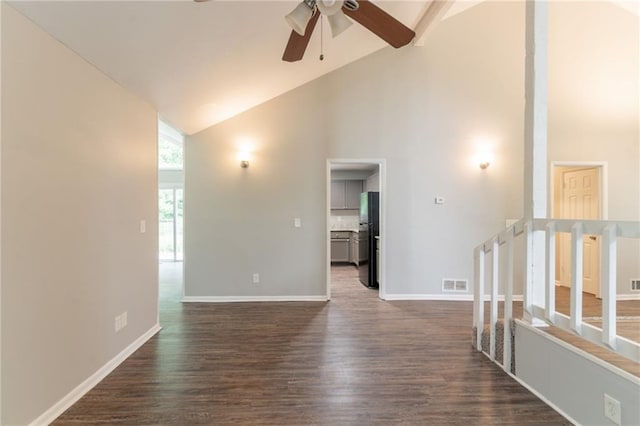 unfurnished room with dark wood-style floors, ceiling fan, and high vaulted ceiling