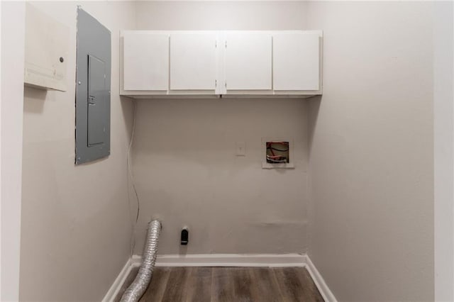 clothes washing area with cabinet space, washer hookup, electric panel, dark wood-style flooring, and baseboards