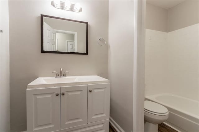 full bath featuring toilet and vanity