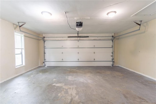 garage with baseboards and a garage door opener