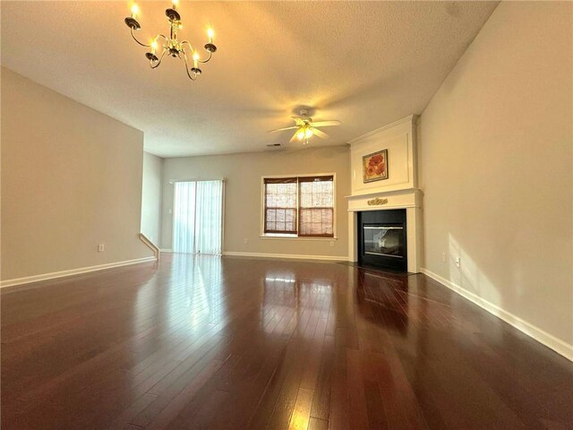 unfurnished bedroom featuring dark hardwood / wood-style floors, a textured ceiling, and a closet