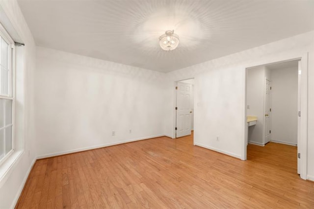 spare room featuring light wood-type flooring