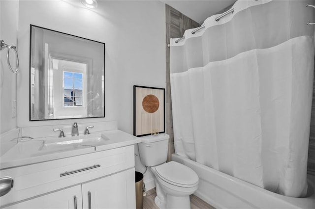 full bathroom featuring vanity, toilet, and shower / bath combo with shower curtain