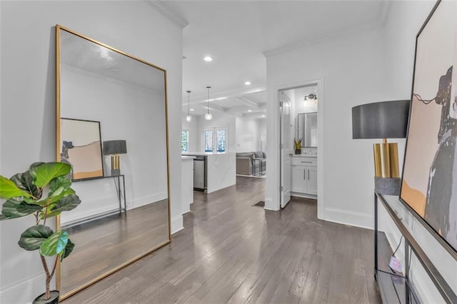 interior space with baseboards, ornamental molding, dark wood finished floors, and recessed lighting