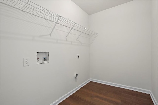 laundry area featuring dark hardwood / wood-style flooring, washer hookup, and hookup for an electric dryer