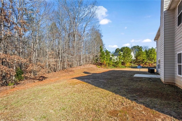 view of yard with central AC