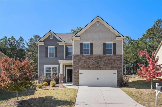 craftsman-style home featuring a front lawn and a garage