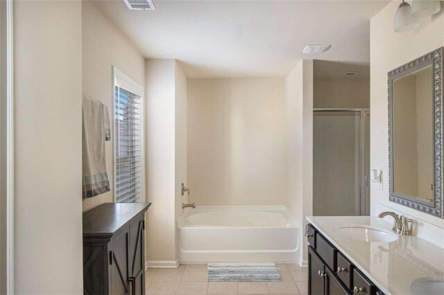 bathroom with vanity, shower with separate bathtub, and tile patterned flooring