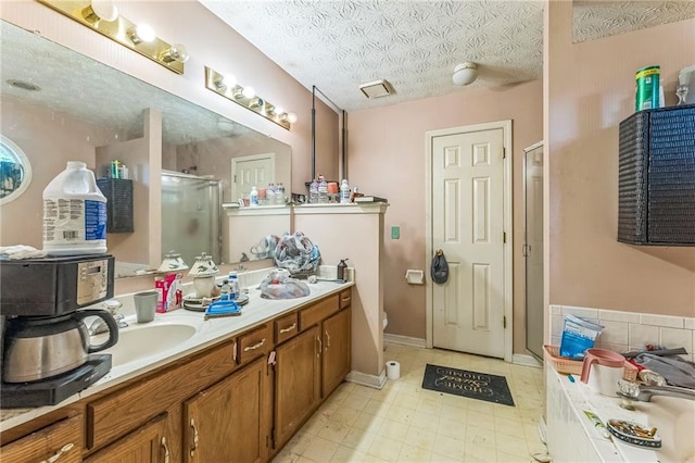 4945 Penscot Way, Stone Mountain, GA 30088 - full bath featuring a stall shower, double vanity, a bath, a textured ceiling, and toilet