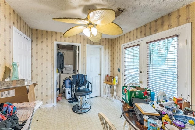 4945 Penscot Way, Stone Mountain, GA 30088 - living area featuring wallpapered walls, tile patterned floors, baseboards, and ceiling fan