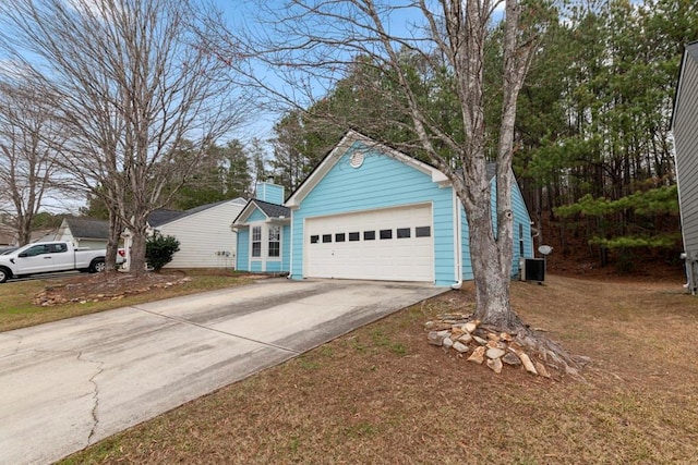 view of front of house featuring concrete driveway and an attached garage