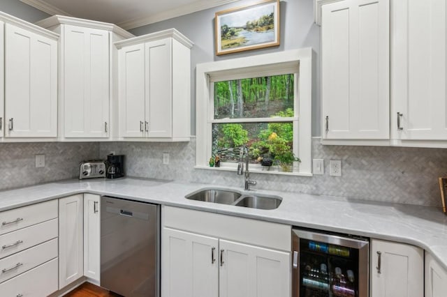 kitchen featuring dishwasher, wine cooler, a sink, crown molding, and white cabinetry