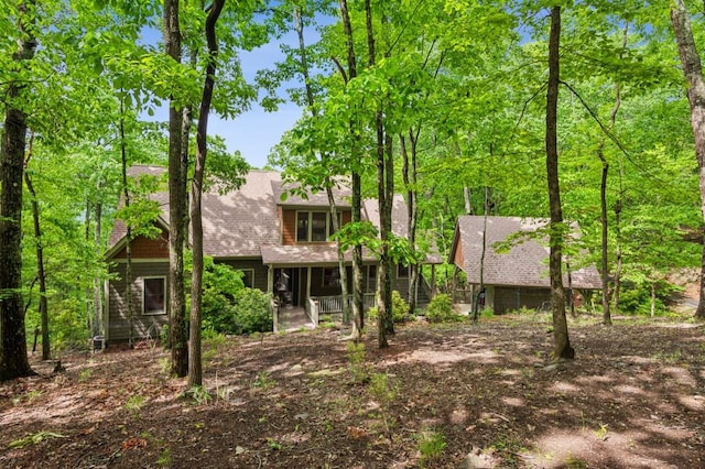 view of front of home featuring a shingled roof