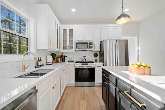 139 Thunder Ridge Ln, Acworth, GA 30101 - kitchen with appliances with stainless steel finishes, white cabinetry, backsplash, and recessed lighting