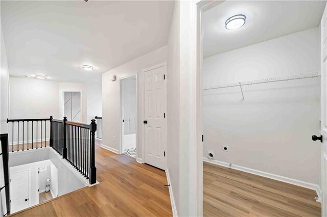 139 Thunder Ridge Ln, Acworth, GA 30101 - corridor featuring an upstairs landing and wood finished floors