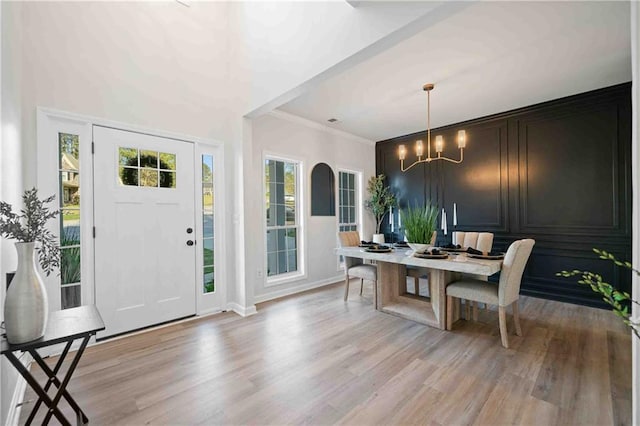 139 Thunder Ridge Ln, Acworth, GA 30101 - dining area with light wood-style floors, a chandelier, and crown molding