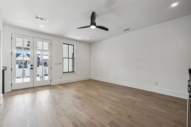 12632 Branyan Cir, Alpharetta, GA 30004 - empty room featuring french doors, a ceiling fan, wood finished floors, and recessed lighting