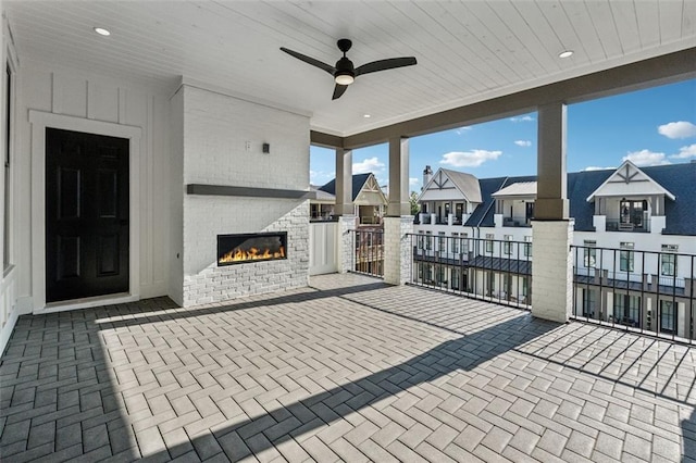 12632 Branyan Cir, Alpharetta, GA 30004 - view of patio with a residential view, an outdoor brick fireplace, and a ceiling fan