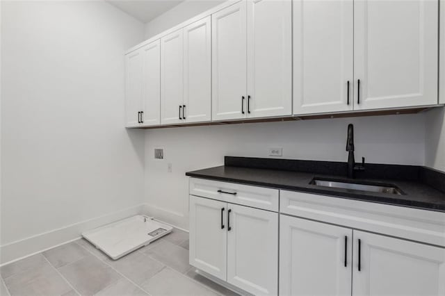 12632 Branyan Cir, Alpharetta, GA 30004 - laundry area featuring hookup for a washing machine, cabinet space, and light tile patterned floors