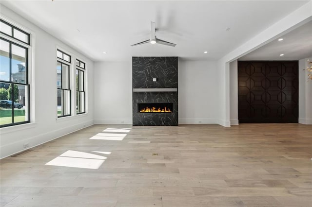 12632 Branyan Cir, Alpharetta, GA 30004 - unfurnished living room with healthy amount of natural light, ceiling fan, recessed lighting, and wood finished floors