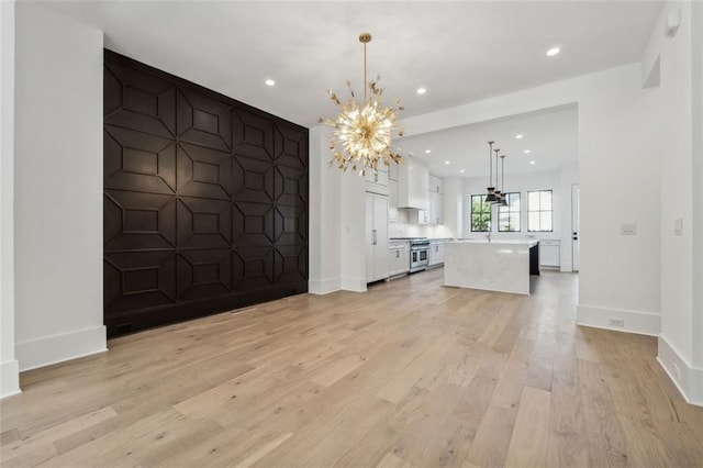 12632 Branyan Cir, Alpharetta, GA 30004 - unfurnished living room with a chandelier, light wood finished floors, and recessed lighting