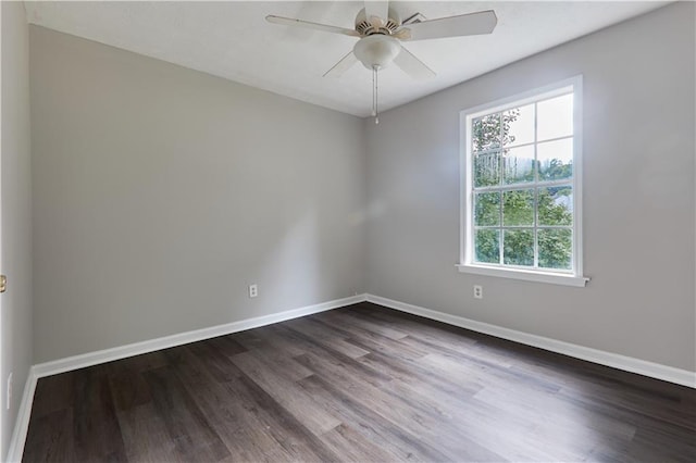 spare room with ceiling fan and dark hardwood / wood-style floors