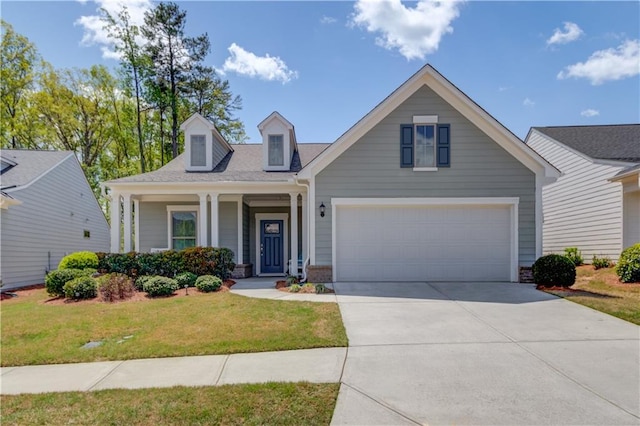view of front facade with concrete driveway, a garage, and a front lawn