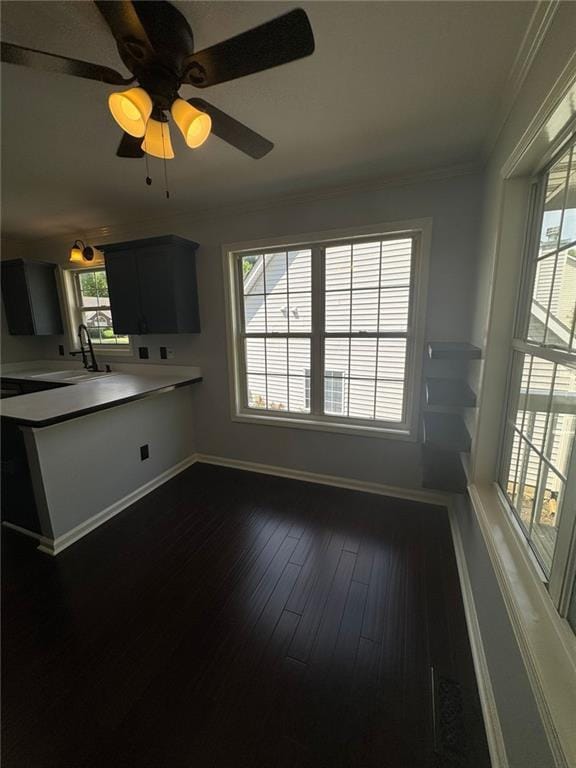 955 Tributary Way, Dacula, GA 30019 - kitchen featuring crown molding, light countertops, dark wood-style floors, and a ceiling fan