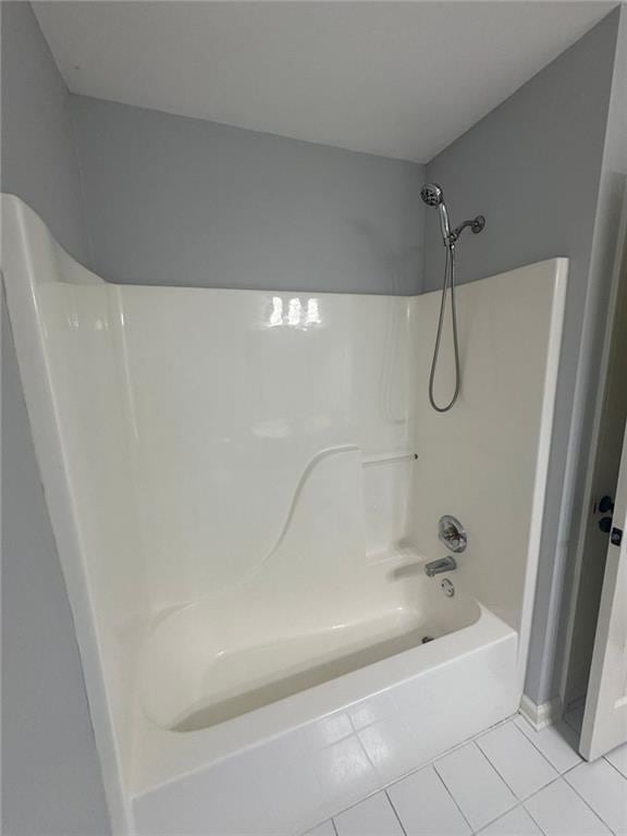 955 Tributary Way, Dacula, GA 30019 - bathroom with tile patterned floors and shower / washtub combination