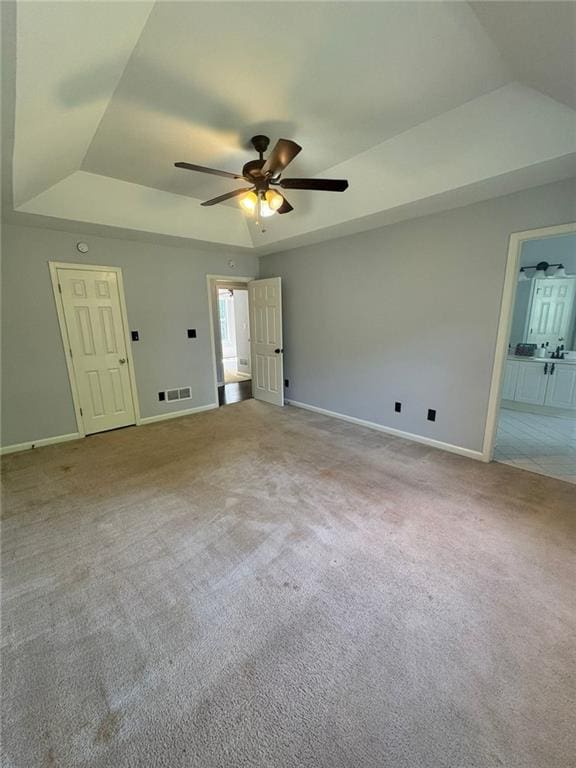 955 Tributary Way, Dacula, GA 30019 - carpeted spare room featuring a raised ceiling, ceiling fan, and vaulted ceiling