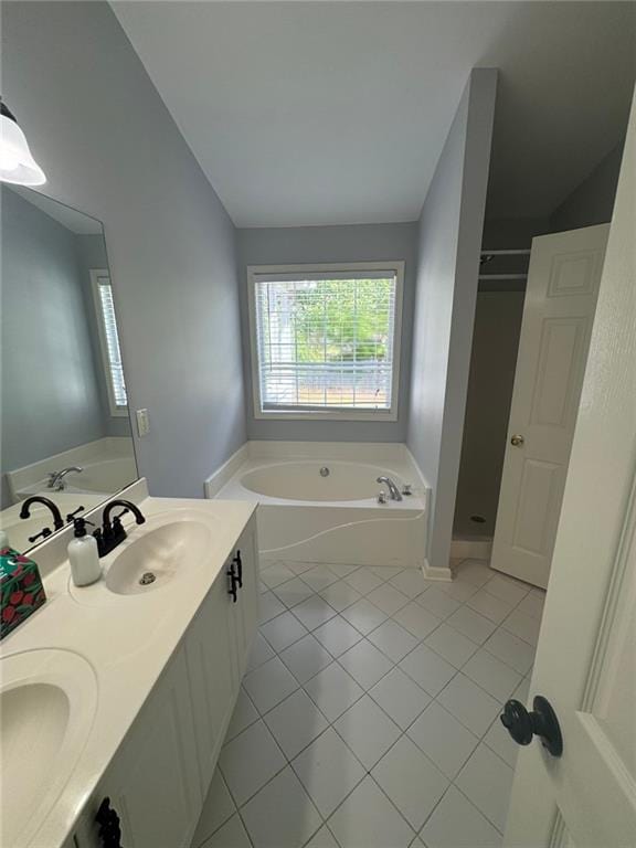 955 Tributary Way, Dacula, GA 30019 - bathroom featuring a garden tub, tile patterned flooring, double vanity, a shower stall, and lofted ceiling