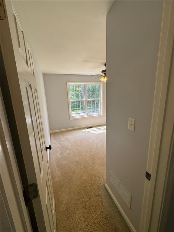 955 Tributary Way, Dacula, GA 30019 - hallway featuring carpet and baseboards
