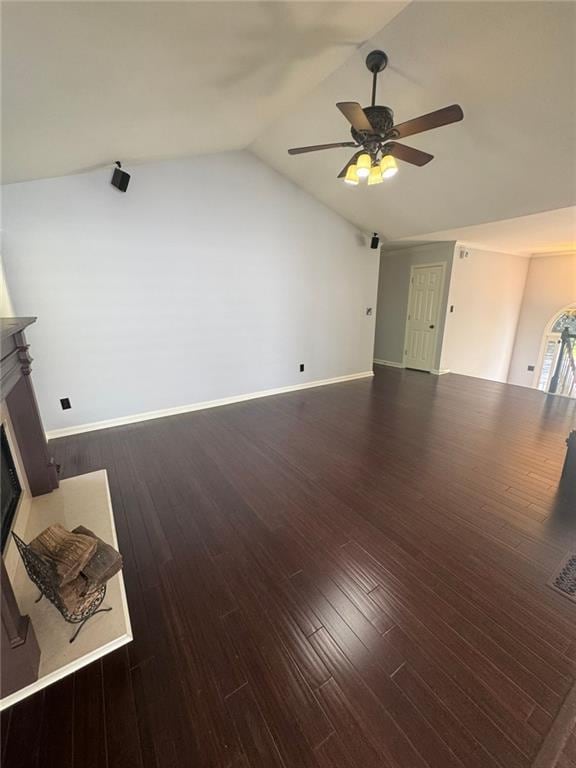 955 Tributary Way, Dacula, GA 30019 - unfurnished living room with a ceiling fan, a fireplace, vaulted ceiling, and wood finished floors