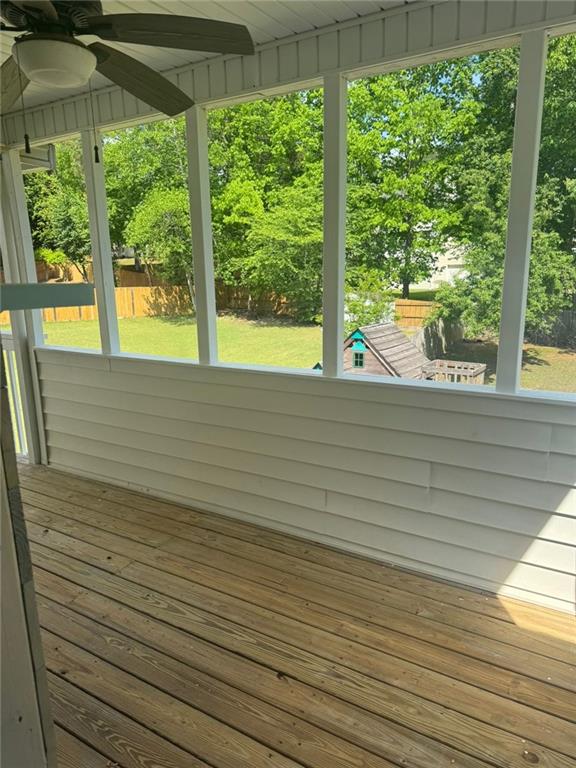 955 Tributary Way, Dacula, GA 30019 - unfurnished sunroom featuring a ceiling fan