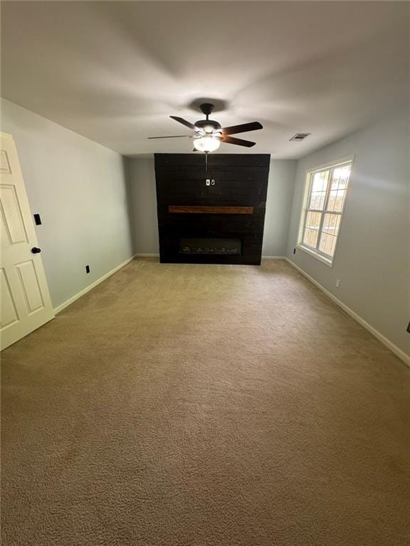 955 Tributary Way, Dacula, GA 30019 - unfurnished living room featuring ceiling fan, a fireplace, and carpet floors