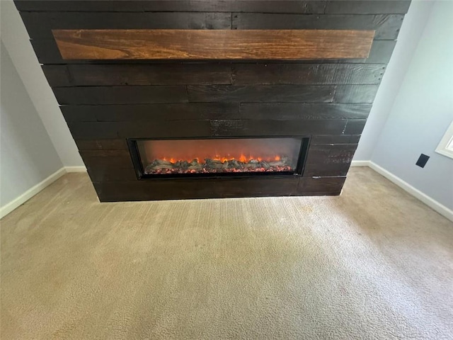 955 Tributary Way, Dacula, GA 30019 - detailed view of a warm lit fireplace and carpet