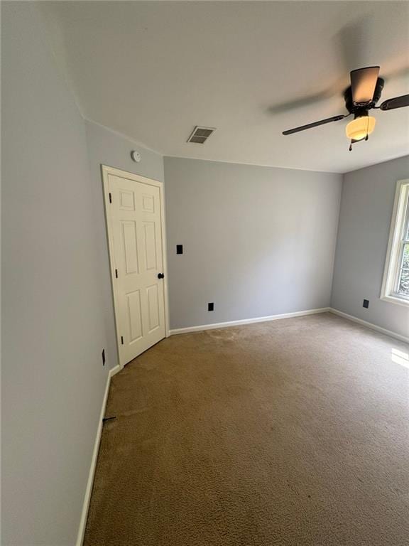 955 Tributary Way, Dacula, GA 30019 - carpeted spare room with baseboards and ceiling fan