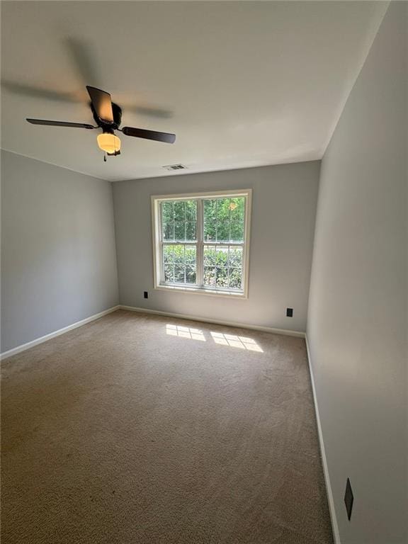 955 Tributary Way, Dacula, GA 30019 - carpeted empty room with baseboards and a ceiling fan