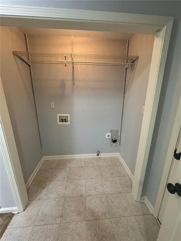 955 Tributary Way, Dacula, GA 30019 - laundry area with hookup for an electric dryer, hookup for a washing machine, hookup for a gas dryer, and light tile patterned flooring