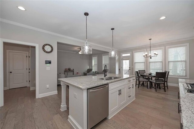 kitchen featuring sink, light stone counters, an island with sink, white cabinets, and stainless steel dishwasher