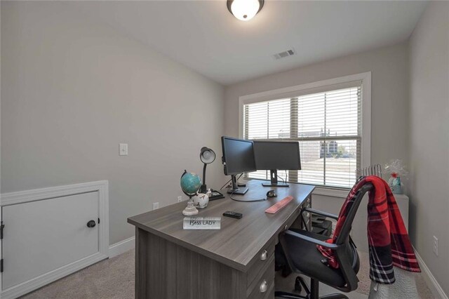 home office featuring light colored carpet