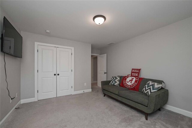 living area featuring carpet flooring