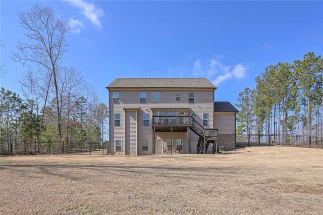 rear view of house featuring a deck