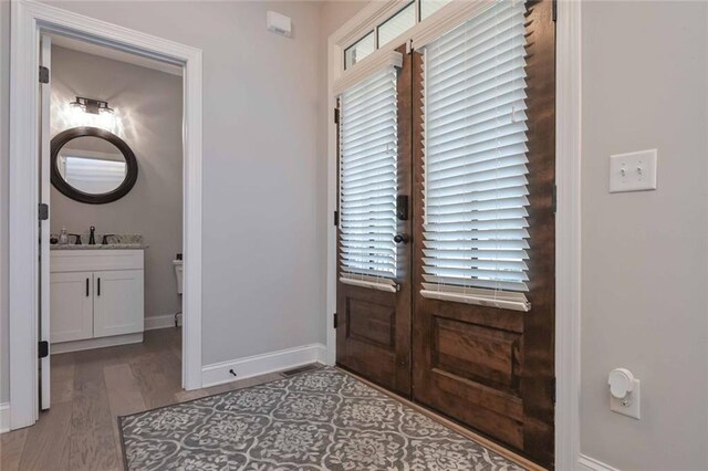 entrance foyer with hardwood / wood-style flooring and plenty of natural light