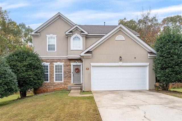 view of front property with a front lawn and a garage