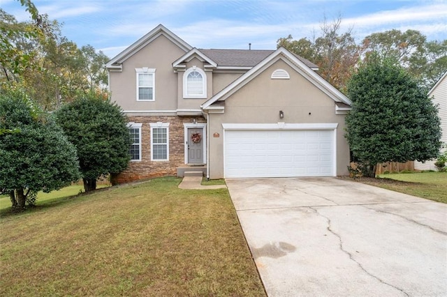 view of front of house featuring a front lawn and a garage