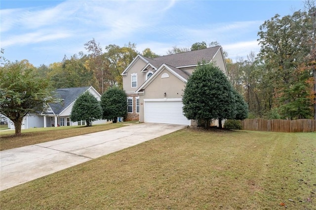 view of front of home with a front yard and a garage