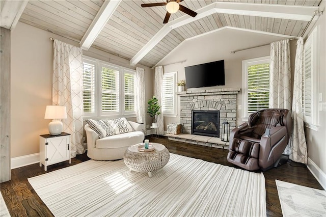 living room with baseboards, a ceiling fan, a healthy amount of sunlight, and dark wood-style floors
